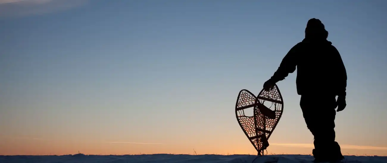 Snowshoeing at sunset